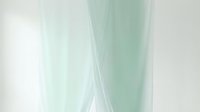 Soft mint green and white abstract flowing fabric waves with translucent layered textures, ideal for backgrounds and design overlays.