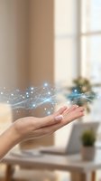 Open hand displaying glowing digital network connections with sparkling light effects in modern office environment for technology presentations.