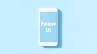 White smartphone displaying Follow Us text on light blue background, social media marketing concept for digital campaigns.