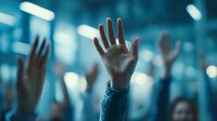 Raised hands silhouettes against blue bokeh lights background. Audience participation, voting, volunteering concept for presentations and corporate events.