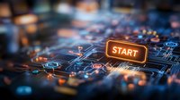 Glowing orange start button on futuristic circuit board background with digital network connections and blue technology elements for business concept.