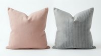 Pair of linen throw pillows in soft pink and sage green with natural texture, suitable for home decor and interior design projects.