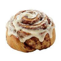 Freshly baked cinnamon roll with cream cheese frosting isolated on white background, ready for bakery, food, and culinary design projects.