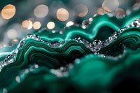 Macro photography of malachite mineral with green wavy patterns and silver crystalline formations, enhanced by bokeh light effects in background.