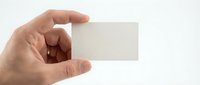 Male hand holding blank white business card mockup against clean background for branding and corporate identity design projects.