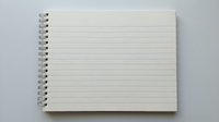 Open spiral notebook with blank lined pages on white background for writing notes and planning projects.