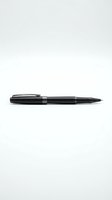 Black ballpoint pen isolated on white background for office supplies, business writing, stationery design and corporate branding projects.