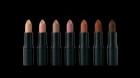 Lipstick collection featuring seven shades in black tubes, ranging from nude to deep brown tones, isolated on transparent background. Ready for cosmetics marketing, beauty product design, print-on-demand, and digital beauty content.