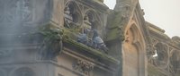 Gothic cathedral architecture detail with ornate stone carvings and decorative elements showcasing medieval craftsmanship and religious building design.