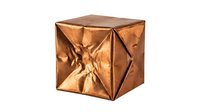 Copper metallic cube with geometric faceted surface and reflective finish isolated on white background for modern design projects.