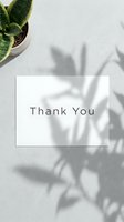 Thank you card on concrete surface with plant shadow overlay and green succulent, minimal aesthetic for greeting and stationery design.