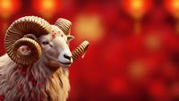 Majestic ram with curved horns against warm bokeh background for zodiac astrology designs and seasonal greeting cards.