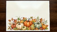 Autumn harvest border with pumpkins, gourds and fall leaves on textured paper background for seasonal greeting cards and thanksgiving decorations.