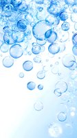 Transparent blue water bubbles floating on white background, abstract aqua pattern for fresh, clean concepts in health, beauty and environmental designs.