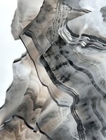 Abstract layered agate mineral with wavy striations in monochrome gray tones, showcasing natural geological formations.