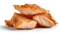 Grilled salmon pieces with crispy crust showing flaky tender meat texture on white background, fresh cooked fish fillet macro shot for seafood menu.