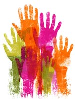 Colorful handprints in vibrant orange, pink and green paint create artistic diversity and unity concept on white background for community projects.