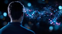 Silhouette of man looking at glowing blue and pink particles floating in dark space, creating magical atmosphere with bokeh light effects and dreamy illumination.