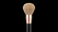 Fluffy powder makeup brush with rose gold ferrule isolated on transparent background, ready for beauty clipart, t-shirt design, stickers, and print on demand use.