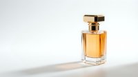 Luxury golden perfume bottle with elegant glass design and metallic cap on white background for cosmetic and fragrance advertising campaigns.