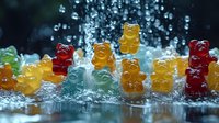 Colorful gummy bears candy with water drops and splashes on dark background, macro photography with selective focus and bokeh effect for food design.