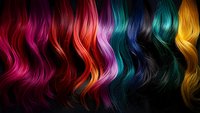 Vibrant wavy hair strands in rainbow colors from pink to yellow arranged horizontally on dark background, showcasing different hair dye shades and styling options.