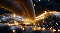 Glowing golden light trails with sparkling particles and finger touch creating magical energy waves against dark background with bokeh effect.