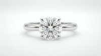 Elegant solitaire diamond engagement ring with round brilliant cut stone in white gold setting on clean white background for jewelry design.