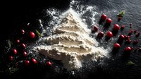 Festive Christmas tree shape made from flour with fresh cranberries and pine sprigs on dark surface for holiday baking and cooking concepts.