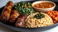 Grilled sausages with rice, beans, and greens on dark plate. Traditional hearty meal with protein and vegetables for restaurant menu or food blog content.
