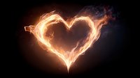 Fiery heart shape made of bright orange flames against dark background for romantic designs and Valentine's Day projects.