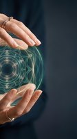 Female hands with rings protecting glowing green energy sphere with sacred geometry patterns on dark blue background for spiritual healing concepts.