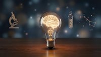Light bulb with glowing brain filament on wooden surface against starry background with scientific instruments, representing innovation and creative thinking.