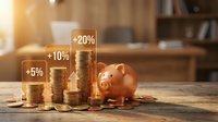 Stacks of golden coins with percentage growth indicators and piggy bank on wooden desk, representing financial growth, savings, and investment returns.