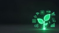 Green technology concept with glowing plant and digital icons representing sustainable innovation, renewable energy, and eco-friendly solutions on dark background.