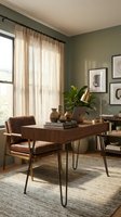 Mid-century modern home office with wooden desk, leather chair, and sage green walls. Natural light streams through sheer curtains. Workspace design and interior decoration.