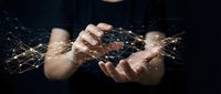 Hands holding glowing digital network connections and data streams on dark background, representing technology, communication, and global connectivity for business solutions.