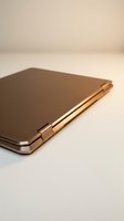 Luxury gold smartphone with sleek metallic finish displayed on neutral background, showcasing modern mobile technology and premium device design for tech and electronics marketing.