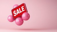 Red sale sign floating with pink spheres on soft pink background, modern minimal retail promotion design for marketing and advertising campaigns.