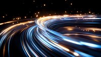 Glowing light trails curve along highway at night creating dynamic blue and orange streaks against dark background, abstract long exposure photography.