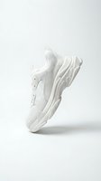 White chunky sneaker with thick sole floating on light background, showcasing modern dad shoe style for fashion and footwear retail concepts.