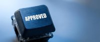 Rubber stamp with approved text on blue background, symbolizing business validation, quality assurance, and official authorization for corporate documents and compliance purposes.