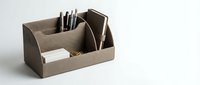 Elegant beige leather desk organizer with pens, cards, and clips on white background, perfect for office and workspace organization.