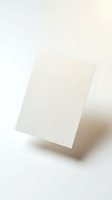 Blank white paper card standing upright on neutral background for mockup design templates and branding presentations.