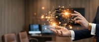 Business professional holding glowing digital network connections with sparkling light effects in modern office environment for technology presentations.