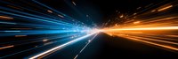 Abstract light trails in blue and orange colors creating dynamic motion effect against black background, symbolizing speed, technology and future movement.
