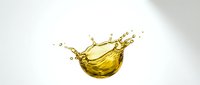 Golden oil splash isolated on white background, perfect for cosmetics, skincare, and wellness product packaging design.