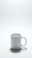 White ceramic coffee mug isolated on white background for mockup design and branding projects.