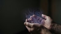 Hands holding glowing purple spiral energy orb with swirling light effect, mystical power concept for fantasy, magic, spirituality and supernatural themes.
