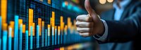 Business success shown through thumbs up gesture against financial market data chart background, demonstrating positive stock trading performance and growth.
